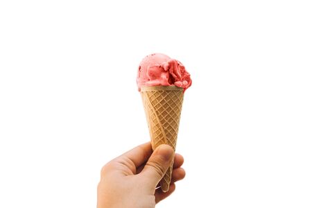 Girl holds ice cream in her hand in a cup isolated on white background.の写真素材