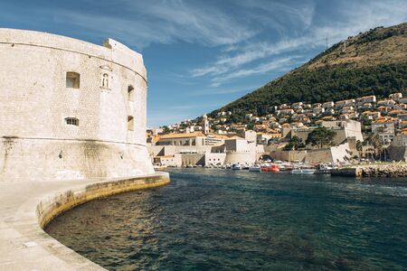 Beautiful view of traditional old buildings and boats in the old town in Dubrovnik in Croatia.の写真素材