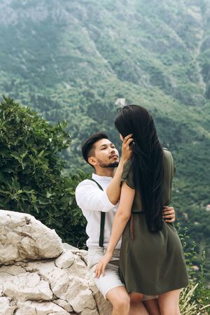 A man hugs a woman. Close relationship or honeymoon.