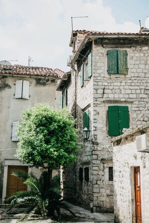 View of a traditional street with old houses in Kotor in Montenegro.の写真素材