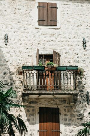 Close up view of a traditional old building with a balcony in Montenegro. Old house with a balconyの写真素材