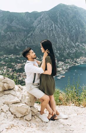 A man hugs a woman. Close relationship or honeymoon.の写真素材