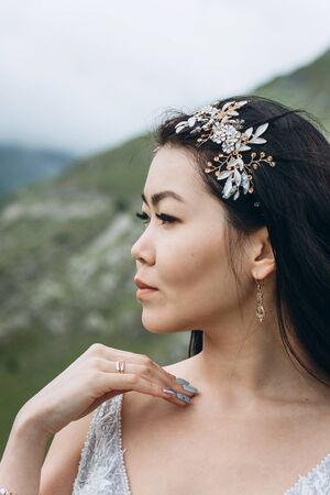 Portrait of a beautiful pensive bride looking into the distanceの写真素材