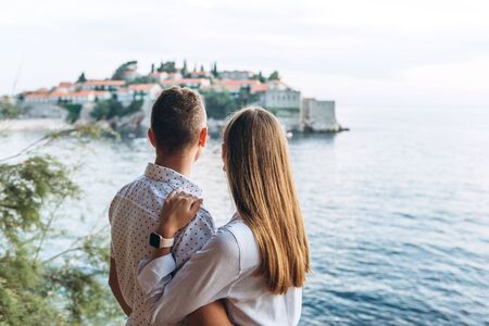 A man and a woman admire a beautiful view in Montenegro.の写真素材