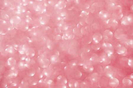 Festive pink abstract background with colorful defocused circular bokeh.の写真素材