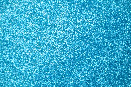 Festive blue abstract background with colorful defocused circular bokeh.の写真素材