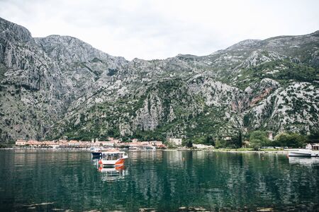 Boats on the sea against the background of the natural landscape in Montenegro.の写真素材