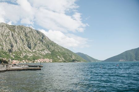 View of the natural landscape in Montenegro. Sea, mountains and coastal city.の写真素材