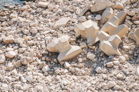 Concrete blocks or breakwaters on the seashore or concrete heavy structures on the shore.の写真素材