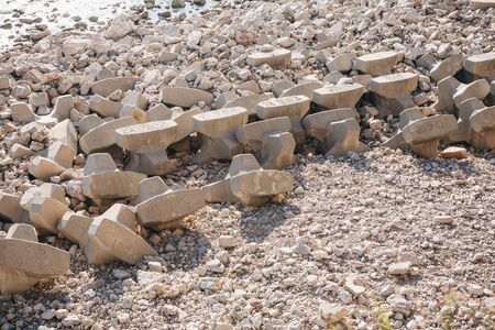 Concrete blocks or breakwaters on the seashore or concrete heavy structures on the shore.の写真素材