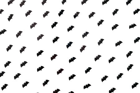 A lot of black bats isolated on a white background. Abstract halloween celebration background.の写真素材