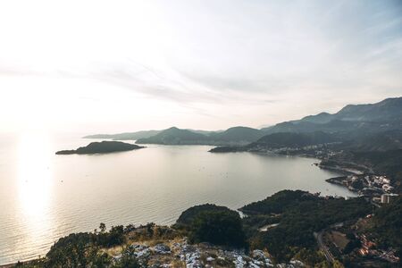 Beautiful view of the natural landscape in Montenegro. Coastline, sea and mountains at sunset.の写真素材