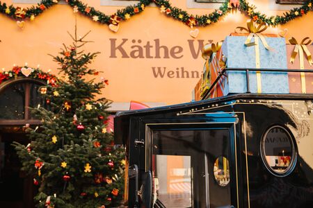 Germany, Rothenburg ob der Tauber, December 30, 2018: Close-up of a decorated car or bus near a toy store during the Christmas holidays.のeditorial素材