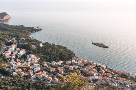 Beautiful bird's-eye view of the sea, island and coastal city in Montenegro.の写真素材