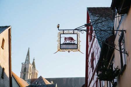 Germany, Rothenburg ob der Tauber, December 30, 2018 - Authentic butcher shop signboardのeditorial素材