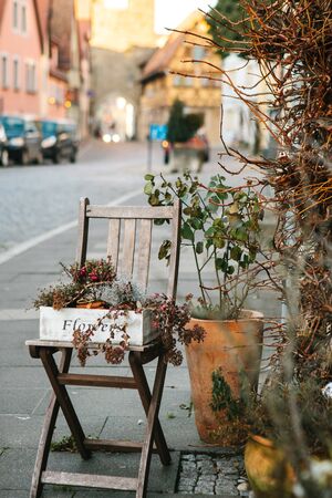 Faded flowers in a box or pot on the street. They were used as decoration, but in the fall became fadedの写真素材
