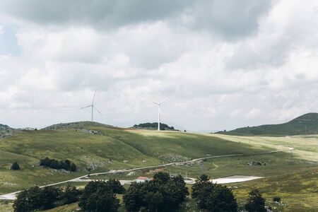 View of the natural landscape and windmills in Montenegro. Eco-friendly energy or alternative energy sources.の写真素材