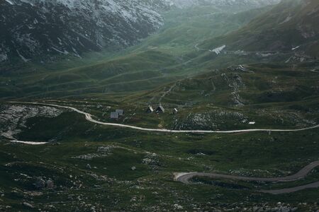 View of the natural landscape and tiny authentic houses in the highlands of Montenegro.