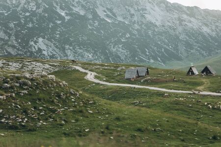 View of the natural landscape and tiny authentic houses in the highlands of Montenegro.の写真素材