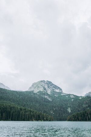 Beautiful view of the lake - Black Lake, forest and mountain landscape in Montenegro.の写真素材