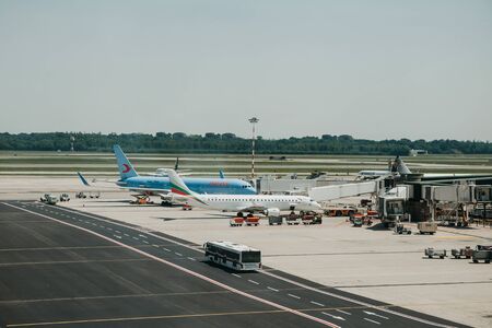 Italy, Milan, July 12, 2019: Airplanes and architecture at the Malpensa Airport in Milan.のeditorial素材