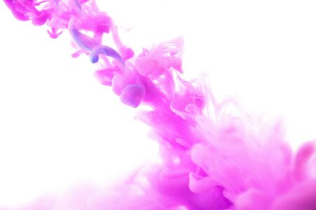 Abstract flowing liquid or purple ink in water on a white background.の写真素材