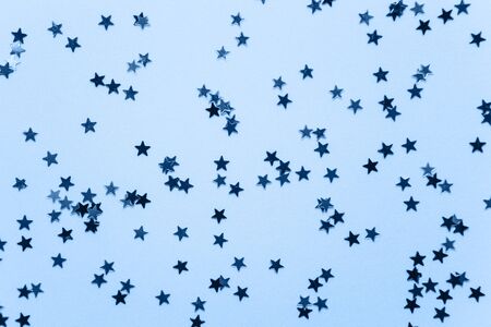 Abstract glowing stars background in classic blue color.の写真素材