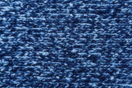 Knitted woolen texture background in trendy classic blue color.の写真素材