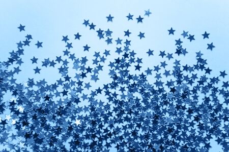 Abstract glowing stars background in classic blue color.