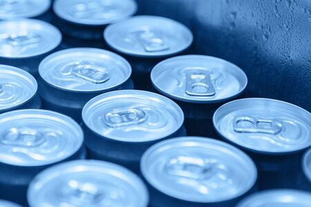 Many metal cans with cool drinks in trendy classic blue color.. Beverages.の写真素材