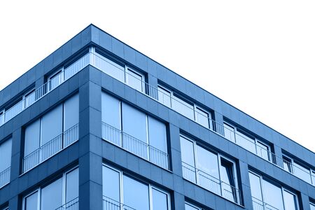 A residential building in trendy classic blue color with cut out sky with white isolated background.の写真素材