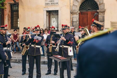 Italy, Verona, May 31, 2019: An orchestra of military trumpeters plays trumpets at a street performance.のeditorial素材