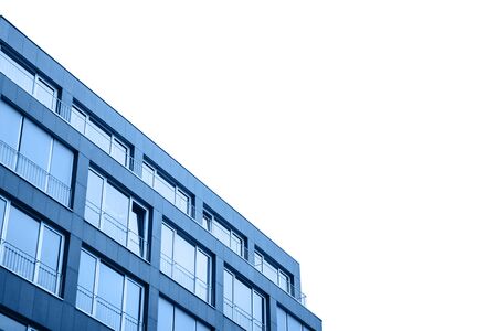 A residential building in trendy classic blue color with cut out sky with white isolated background.の写真素材