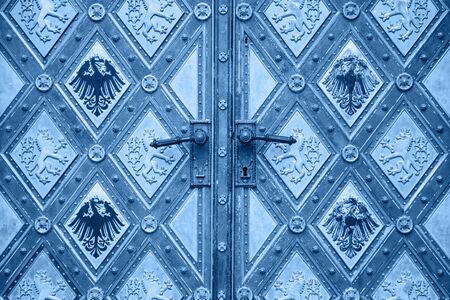 Beautiful antique vintage patterned door background in trendy classic blue color.の写真素材