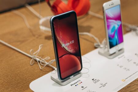 Turkey, Istanbul, December 17, 2019: Modern phones are iPhone X and nearby iPhone 8 in Apple Store.のeditorial素材