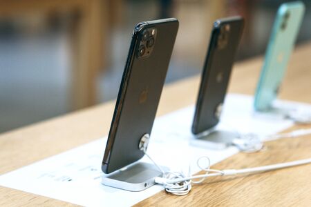Turkey, Istanbul, December 17, 2019 New Modern iPhone 11 Series at Apple Store. Rear view of phones with three cameras.のeditorial素材