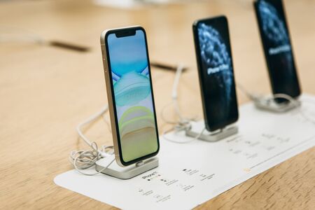 Turkey, Istanbul, December 17, 2019: The latest modern iPhone 11 and nearby iPhone 11 Pro in a row at the Apple Store.のeditorial素材