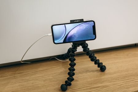 Turkey, Istanbul, December 17, 2019: IPhone X on a special stand for taking pictures.のeditorial素材