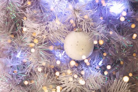 Christmas holiday tree with ball and holiday lights. Christmas background.の写真素材