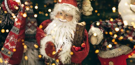 Christmas holiday background with Santa Claus and other Christmas baubles and lights.の写真素材