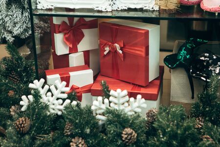 Holiday Christmas or New Year boxes with gifts or for gifts in a shop windowの写真素材