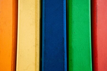 Wooden background from multi-colored boards arranged in a row.の写真素材