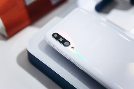 Turkey, Istanbul, December 20, 2019: Close-up of the back cover or rear view of the new modern Samsung A70 smartphone with three cameras.のeditorial素材