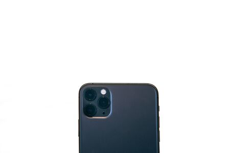 Modern phone with a triple camera on a white background.の写真素材