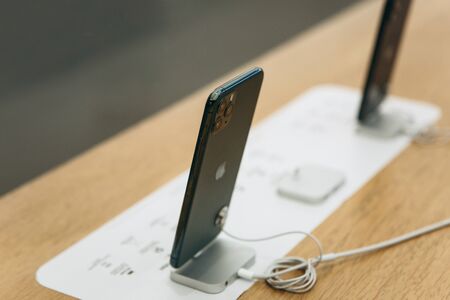 Turkey, Istanbul, December 17, 2019 New Modern iPhone 11 Series at Apple Store. Rear view of phones with three cameras.のeditorial素材