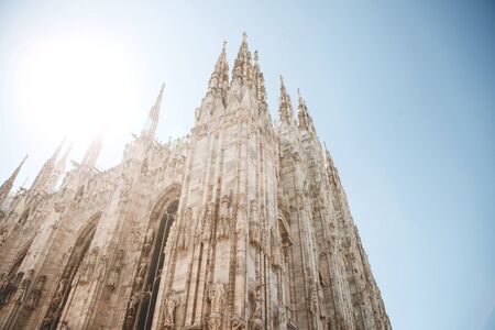 Beautiful view of the ancient Duomo Cathedral in Milan in Italy. It is one of the most popular tourist attractions in Italy.の写真素材
