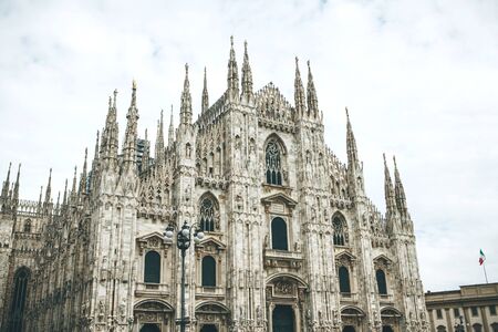 Beautiful view of the ancient Duomo Cathedral in Milan in Italy. It is one of the most popular tourist attractions in Italy.の写真素材