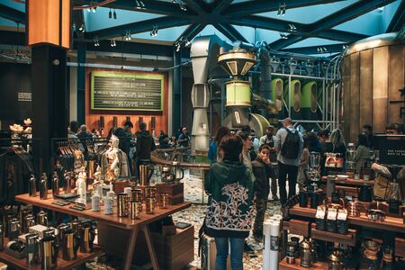 Italy, Milan, May 30, 2019: People, tourists and coffee lovers at Starbucks Reserve in Milan. The interior of the coffee shop.のeditorial素材