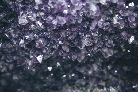 Close-up or macro of a lilac or violet mineral of amethyst druseの写真素材
