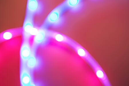 Blurred abstract background fluorescent lamp on a red background.